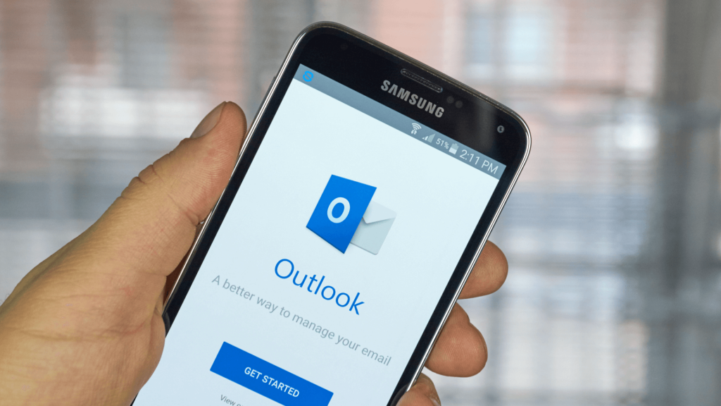 the Microsoft Outlook logo on a Samsung smartphone screen