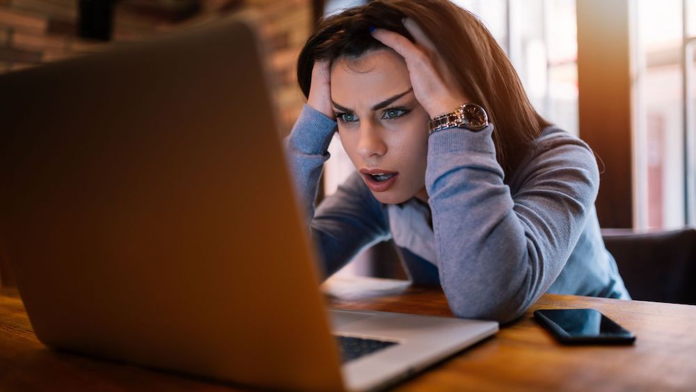 Frustrated woman looking at laptop | Challenges of Sales Enablement | Linkpoint360